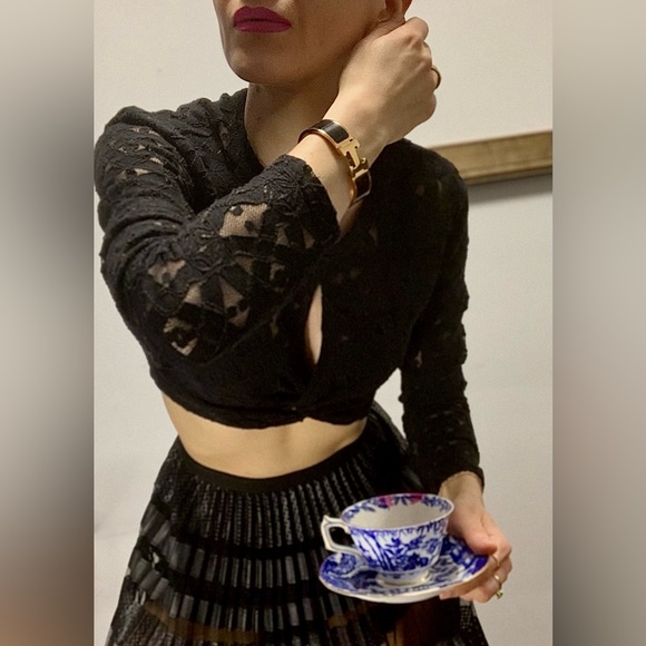 BCBG MaxAzria black lace crop top.Has a split in chest area.Very stretchy.Size S - Picture 4 of 4